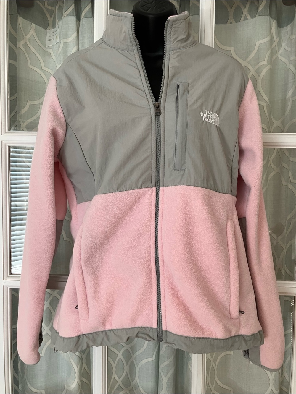 The North Face Women’s size L pink and gray fleece zip-up jacket